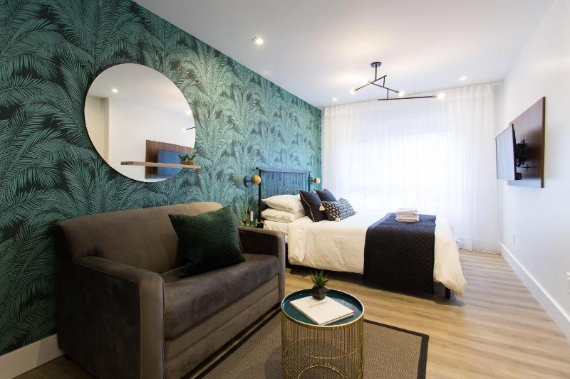 Studio Palms Steps from JeanTalon Market Full Bath by Den Stays Images