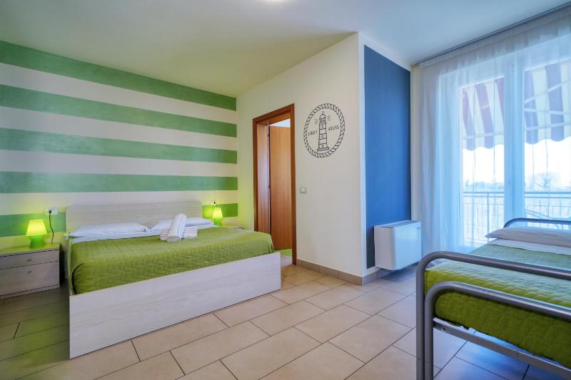 Triple Room with Balcony and Partial Lake View  image 1