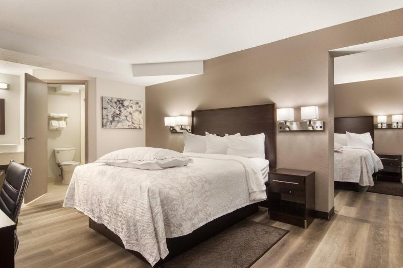 Premium Suite with Three Queen Beds with Kitchenette Smoke Free (Upgraded Bedding and Snack Box) image 1