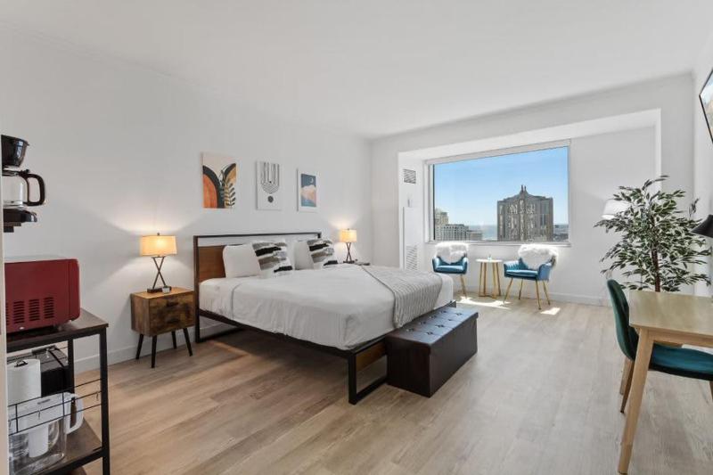 Boardwalk King Bed Retreats by CozySuites Images