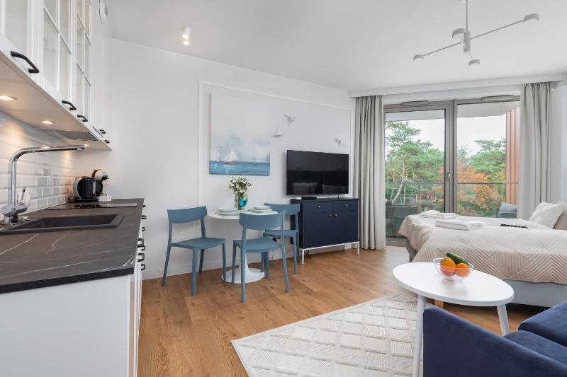 Mazowiecka Apartments Close to the Beach Access to Swimming Pool Sauna & Jacuzzi Parking by Noclegi Renters - image 45