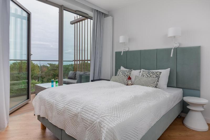 Mazowiecka Apartments Close to the Beach Access to Swimming Pool Sauna & Jacuzzi Parking by Noclegi Renters - image 7