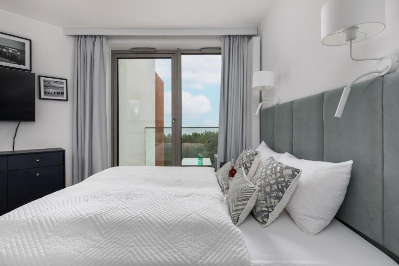 Mazowiecka Apartments Close to the Beach Access to Swimming Pool Sauna & Jacuzzi Parking by Noclegi Renters - image 36