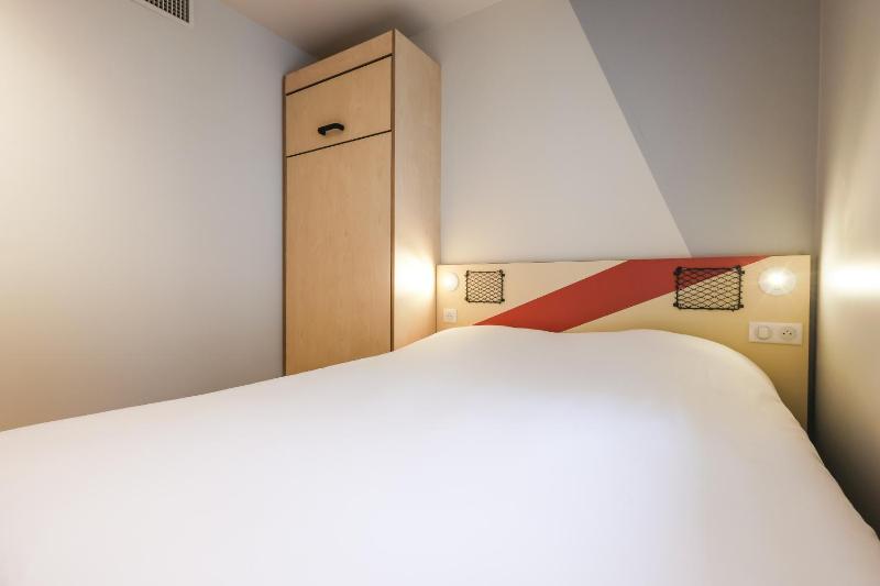 Room with One Queen Bed and an armoire bed image 4