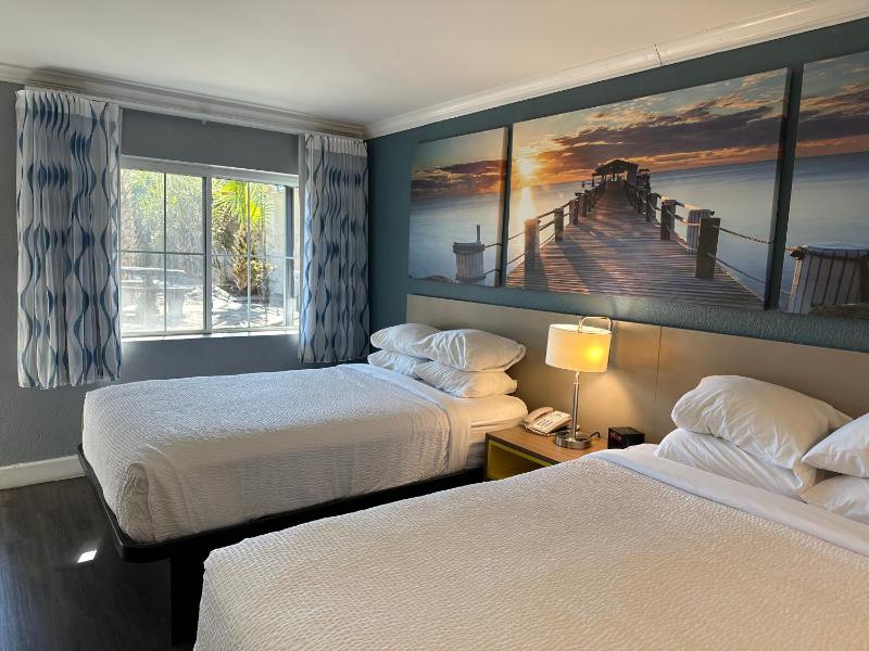 Room with One King and Two Double Beds with Bath Tub - Mobility Accessible/Non-Smoking image 1