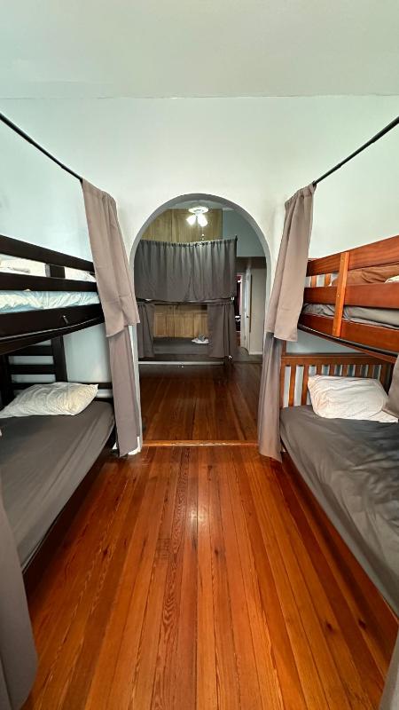 Bed in 7 Bed Mixed Dormitory Room with Ensuite Bathroom image 1