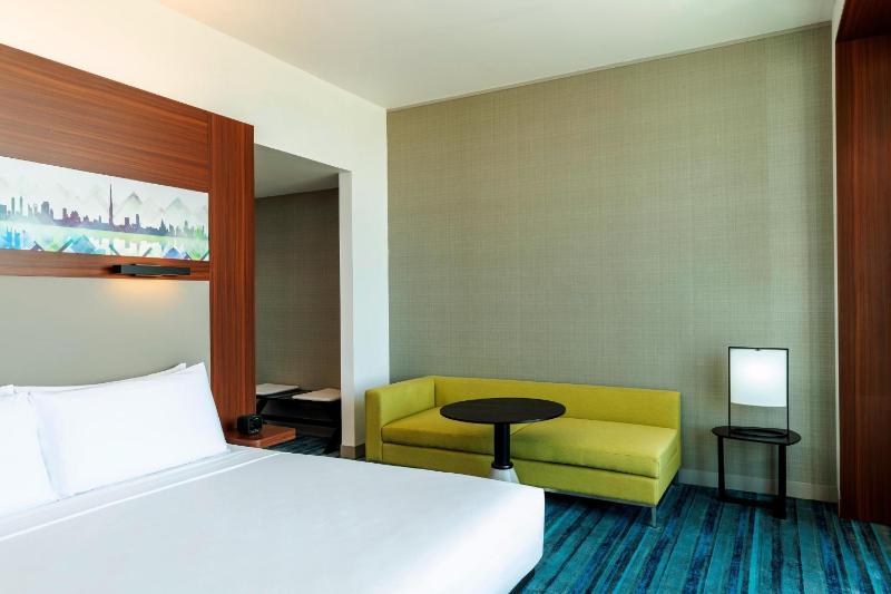Savvy Suite – King Bed (Living Room + Two Bathrooms + Complimentary Shuttle to Expo Metro Station & Al Maktoum International Airport) image 1