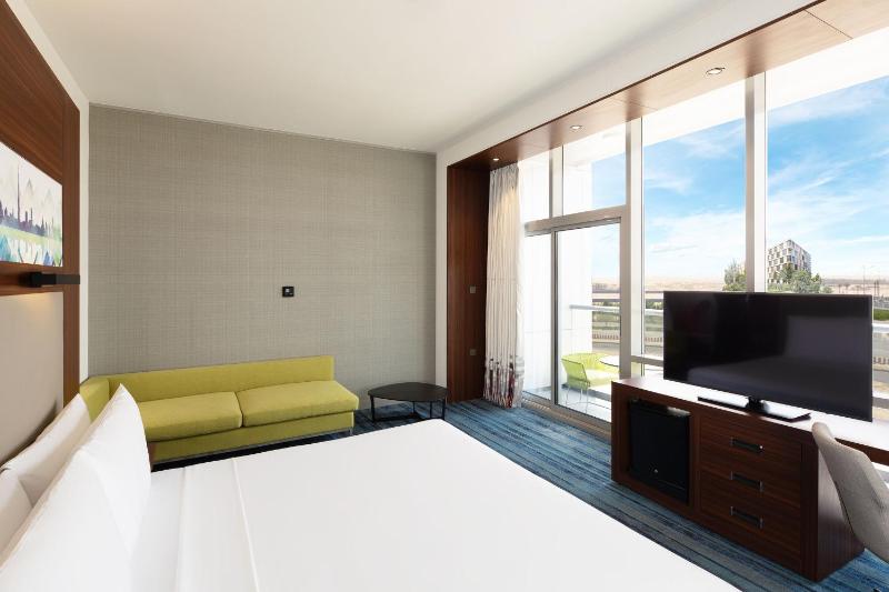 Savvy Suite – King Bed (Living Room + Two Bathrooms + Complimentary Shuttle to Expo Metro Station & Al Maktoum International Airport) image 4