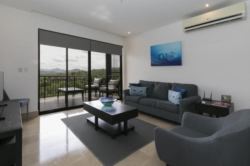 Cozy 1BR Condo with Partial Ocean View - Roble Sabana - Reserva Conchall - image 1