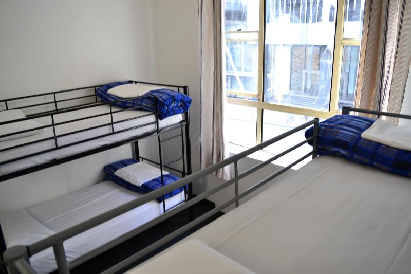 Bed in 4-Bed Mixed Dormitory Room with Shared Bathroom image 1