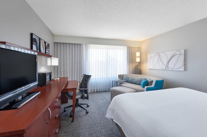 Larger Guest Room with Two Double Beds and Sofa Bed image 1