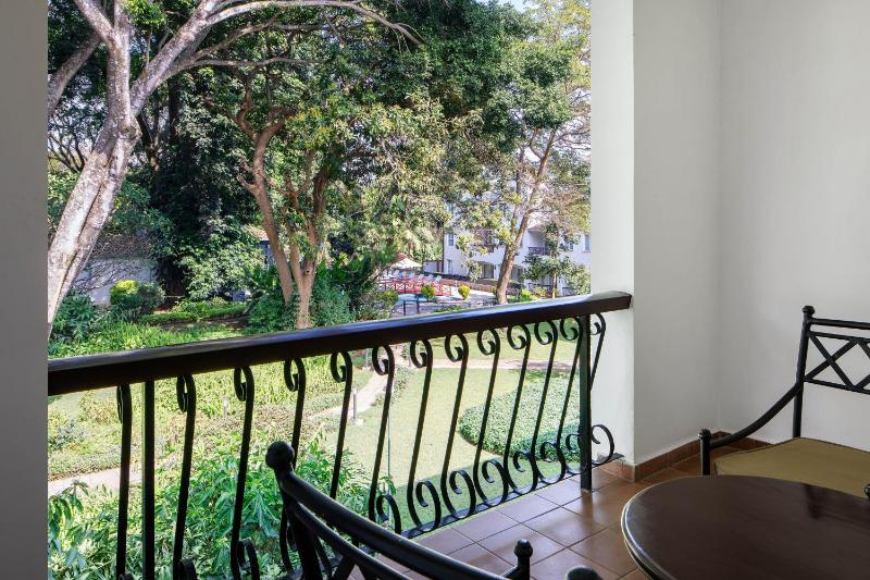 Premium Deluxe Queen Room with Two Queen Beds, Balcony and Garden View