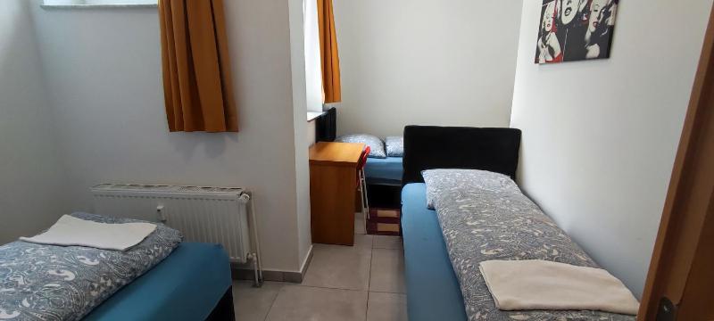 Basic Triple Room with Shared Bathroom image 1