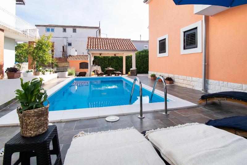 Apartments and Room Agiss with pool - image 1