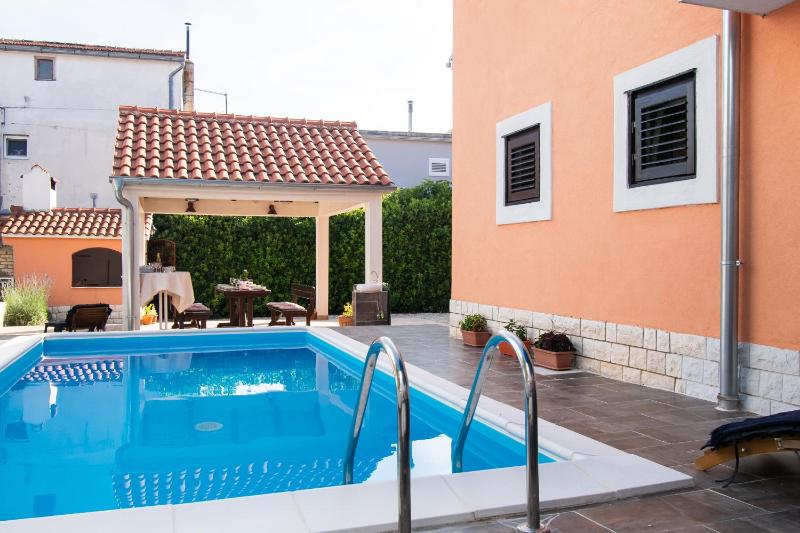 Apartments and Room Agiss with pool - image 7