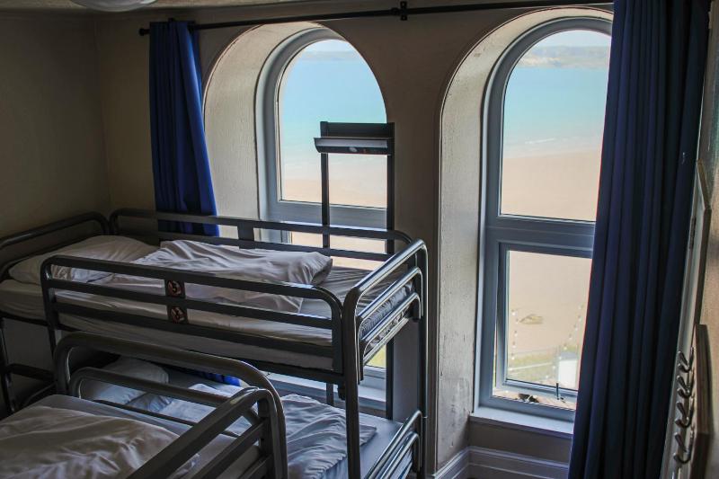 Bed in 10-Bed Female Dormitory Room with Shared Bathroom image 1