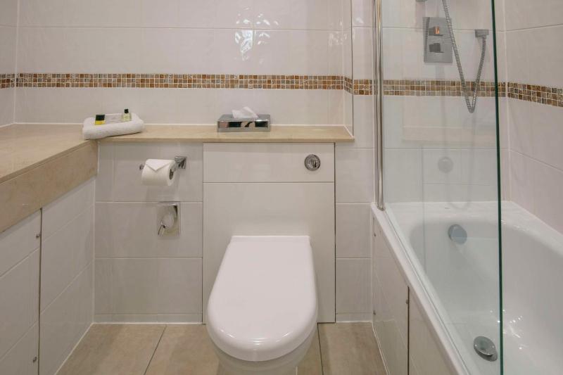 Economy room with double bed and internal window to corridor image 3