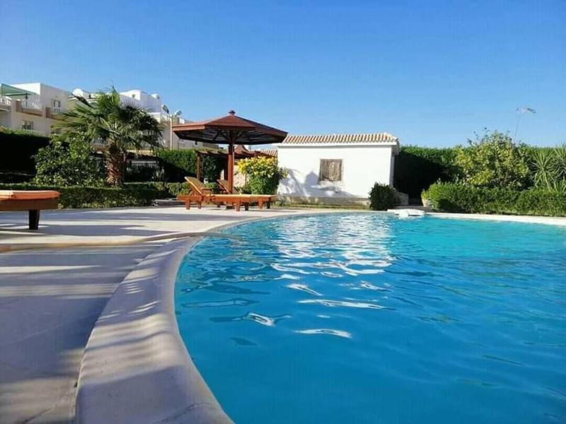 One room in a compound with the swimming pool Images