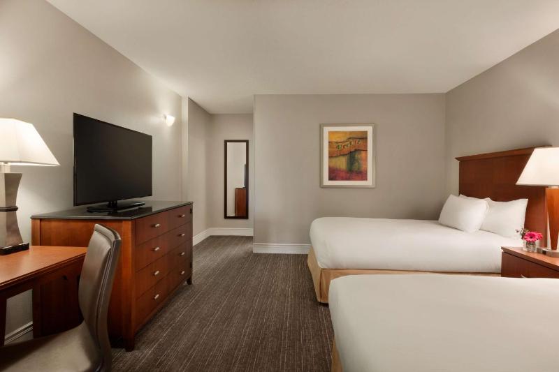 One-Bedroom Suite with Two Double Beds and Sofa Bed image 2