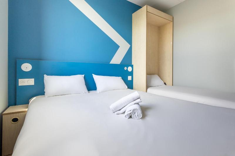 Room with One Queen Bed and One Bunk Bed image 2