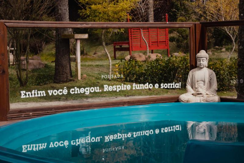 Chalés e Suítes Jardim do Buda com piscina aquecida - image 15