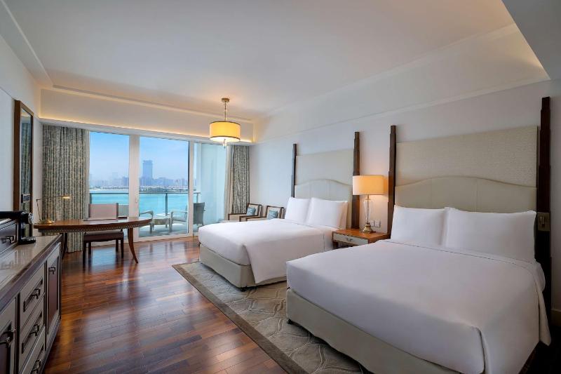 Deluxe Queen Room with Two Queen Beds and Palm Sea View