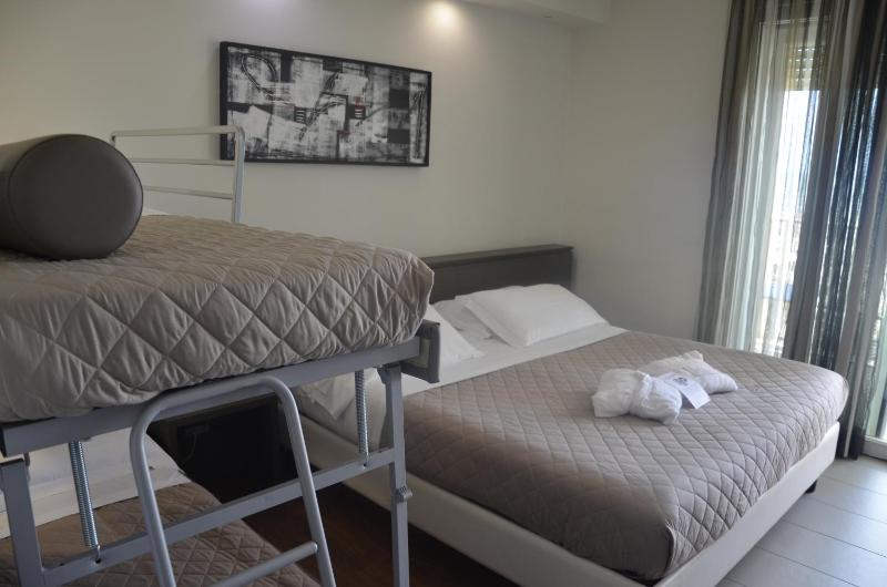 Lateral sea view Classic Quadruple Room with Balcony and pool access image 3