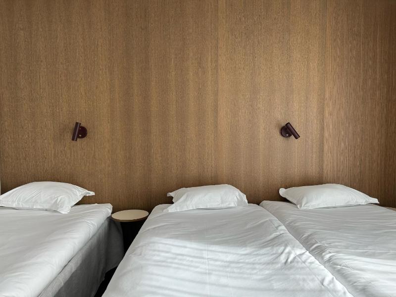 Family Room with Three Single Beds and Balcony - Non-Smoking image 1