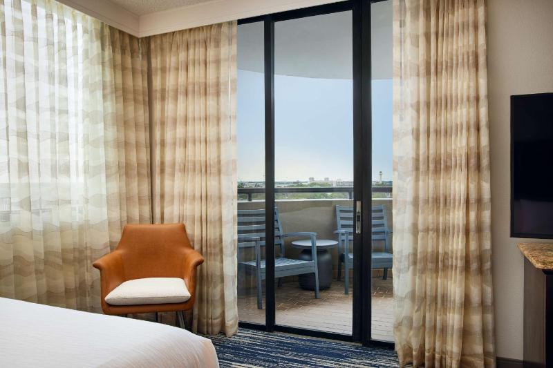 Two-Room Corner Suite with Two Queen Beds and Sleeper Sofa - Balcony image 1