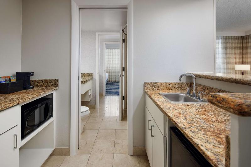Two-Room Corner King Suite with One King Bed and Sleeper Sofa - Balcony image 2