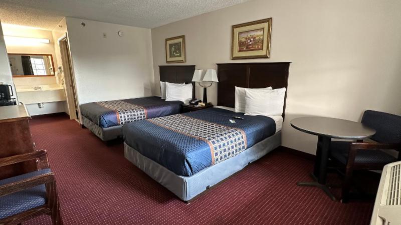Double Room with Two Double Beds, Mobility Access and Bathtub with Grab Bars, Smoking image 1