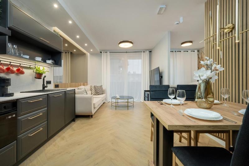 Black and Beige Apartment with Balcony and Parking in Wrocław by Noclegi Renters - image 20