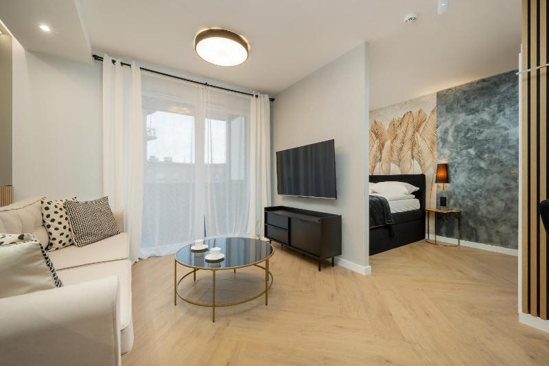 Black and Beige Apartment with Balcony and Parking in Wrocław by Noclegi Renters - image 19