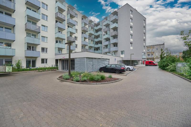 Black and Beige Apartment with Balcony and Parking in Wrocław by Noclegi Renters - image 18