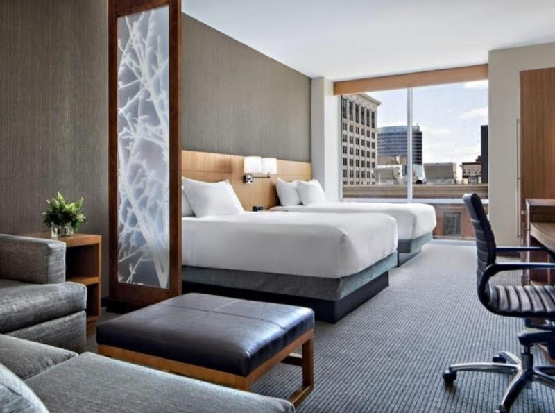 Queen Room with Two Queen Beds with Sofa Bed and City View image 2