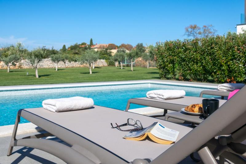 Villa Arestea near Pula with 35 m2 heated pool sea view wellness & kids playground - image 22