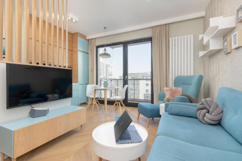 Bright Blue Apartment with Balcony Parking and Air Conditioning in Warsaw by Noclegi Renters - image 13