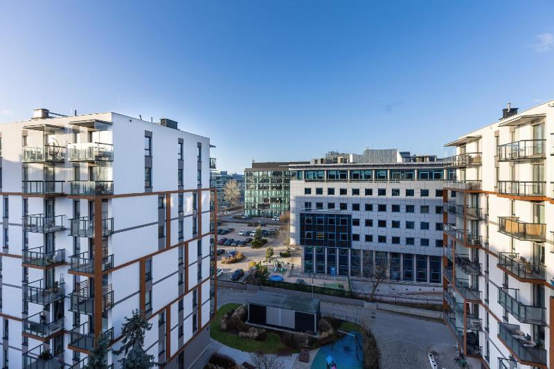 Bright Blue Apartment with Balcony Parking and Air Conditioning in Warsaw by Noclegi Renters - image 12