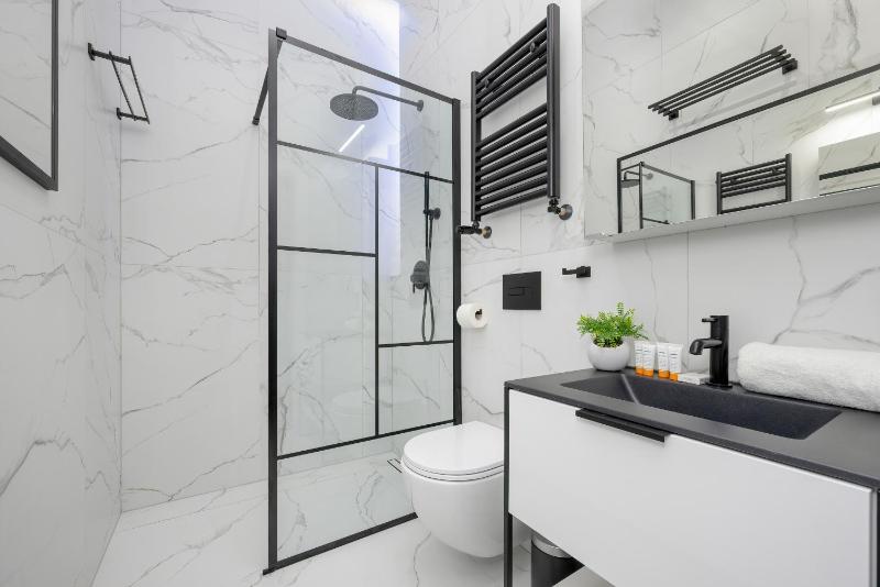Exclusive Grey and Red Apartment in Warsaw Center by Noclegi Renters - image 2