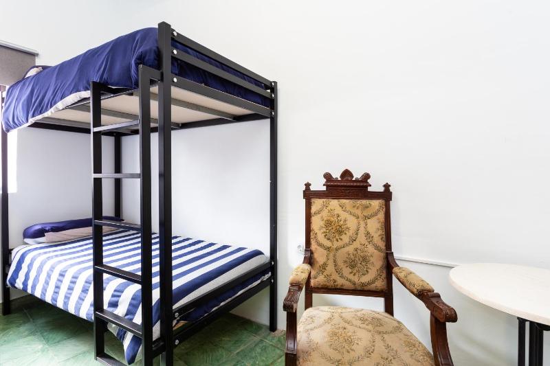Single Bed in Dormitory Room image 1