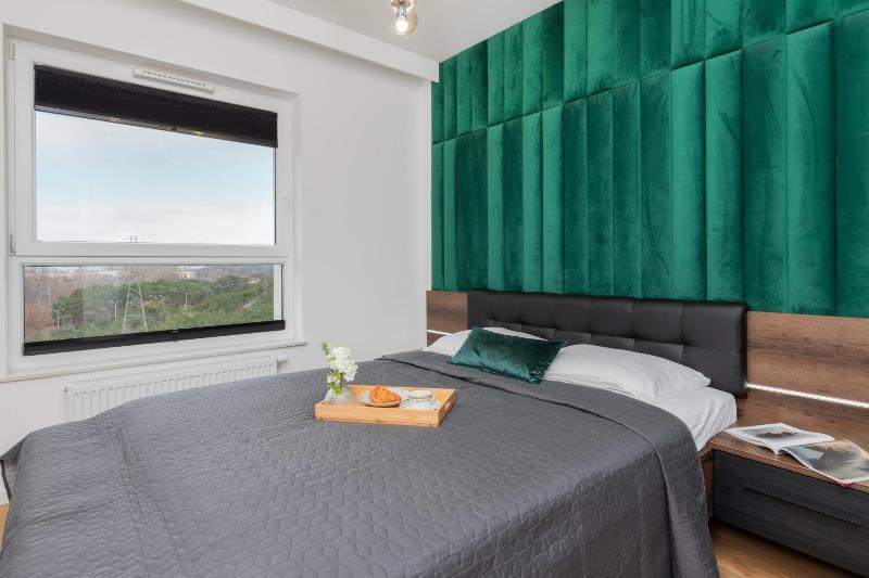 9th Floor Green and Grey Apartment in Gdańsk Brzeźno with Two Bedrooms and Parking by Noclegi Renters - image 1