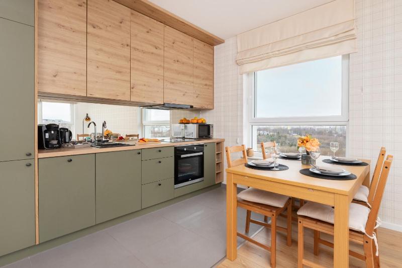 9th Floor Green and Grey Apartment in Gdańsk Brzeźno with Two Bedrooms and Parking by Noclegi Renters - image 16