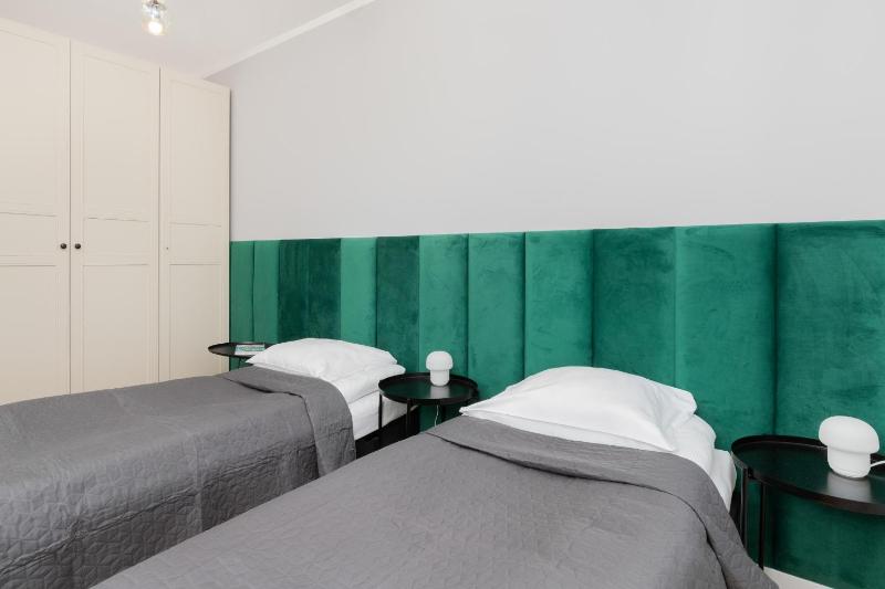 9th Floor Green and Grey Apartment in Gdańsk Brzeźno with Two Bedrooms and Parking by Noclegi Renters - image 2