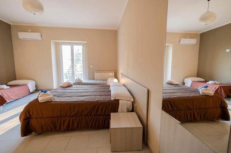 Deluxe Quadruple Room with Balcony image 1