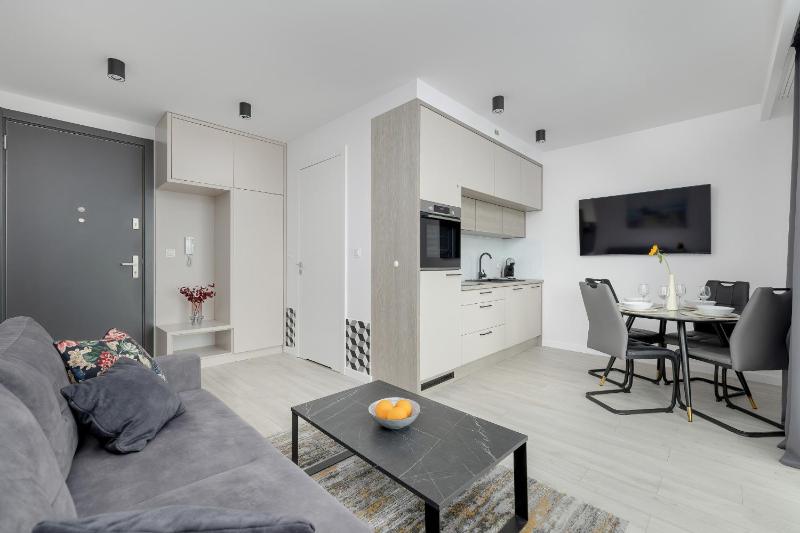 Modern Apartment with Balcony and Parking by Noclegi Renters - image 12
