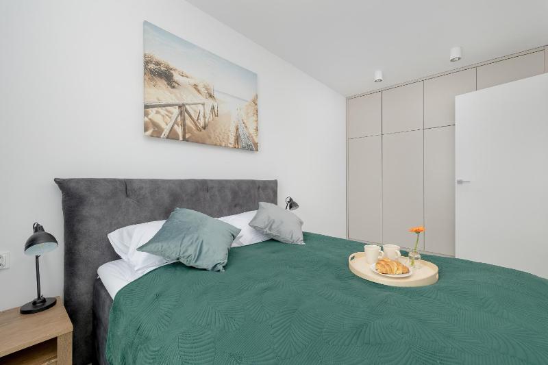 Modern Apartment with Balcony and Parking by Noclegi Renters - image 13