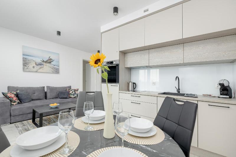 Modern Apartment with Balcony and Parking by Noclegi Renters - image 18