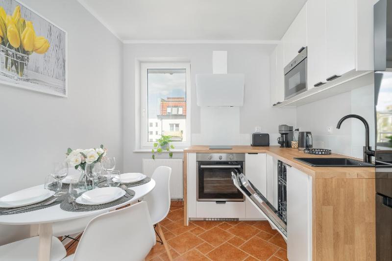 Spacious Apartment Ideal for Families by Noclegi Renters - image 18