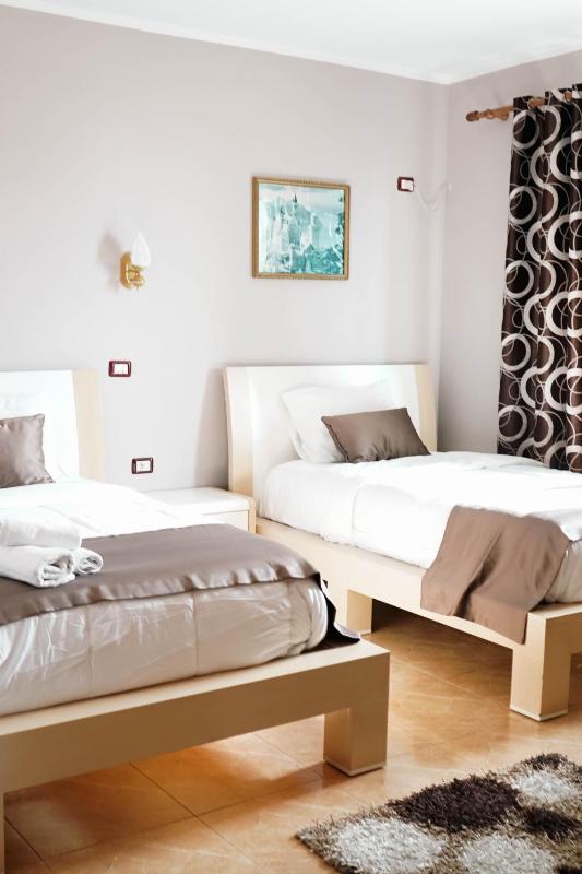 Quadruple Room with Balcony and Partial Sea View image 1