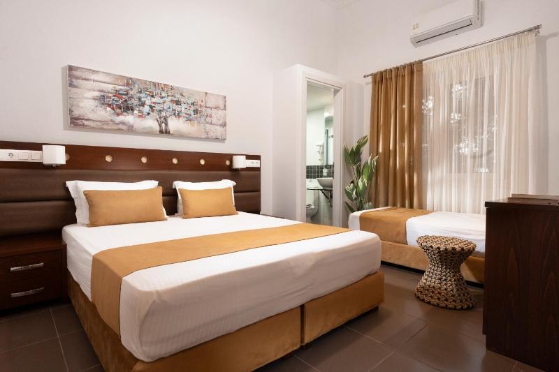 Economy Triple Room in the Garden image 1